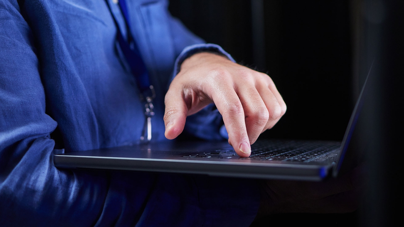 Person holding computer